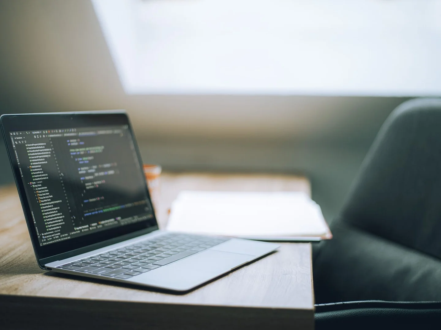 Clean laptop workspace with code open on the screen